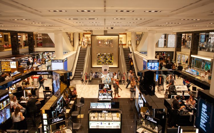 Image of crowded shoppers in a Dubai mall during Ramadan, with bustling aisles and people browsing displays and making purchases.